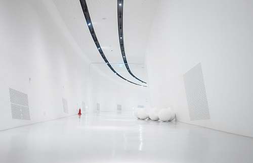 white space white hallway and wall with turned-on light fixture interior